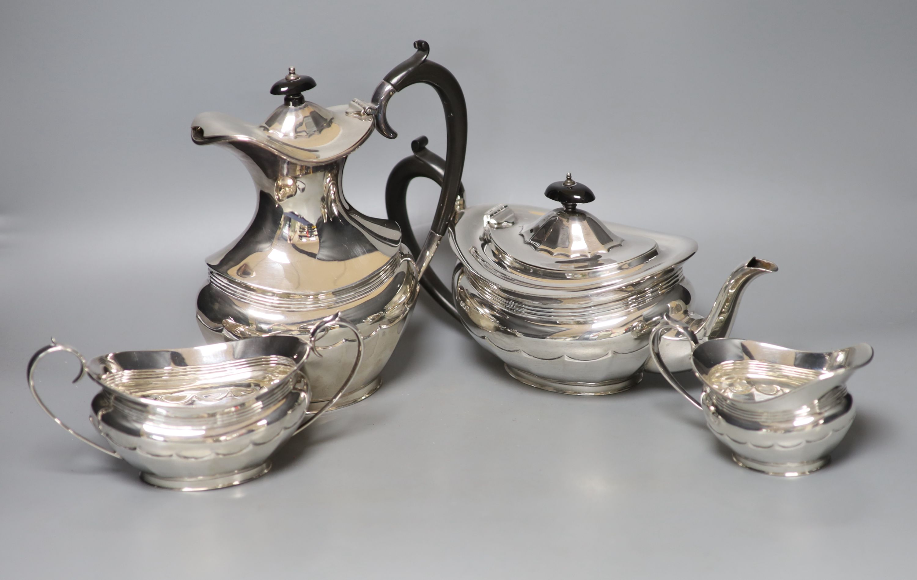 A George V silver four piece oval tea service, R.F. Mosley & Co, Sheffield, 1924 & 1931